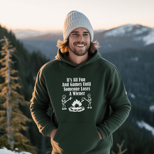 Our Camping hoodie features two adorable stick figure people roasting wieners over a cozy campfire. And with the hilarious slogan "It's All Fun & Games Until Someone Loses A Wiener," you'll be the life of the party at any camping trip!